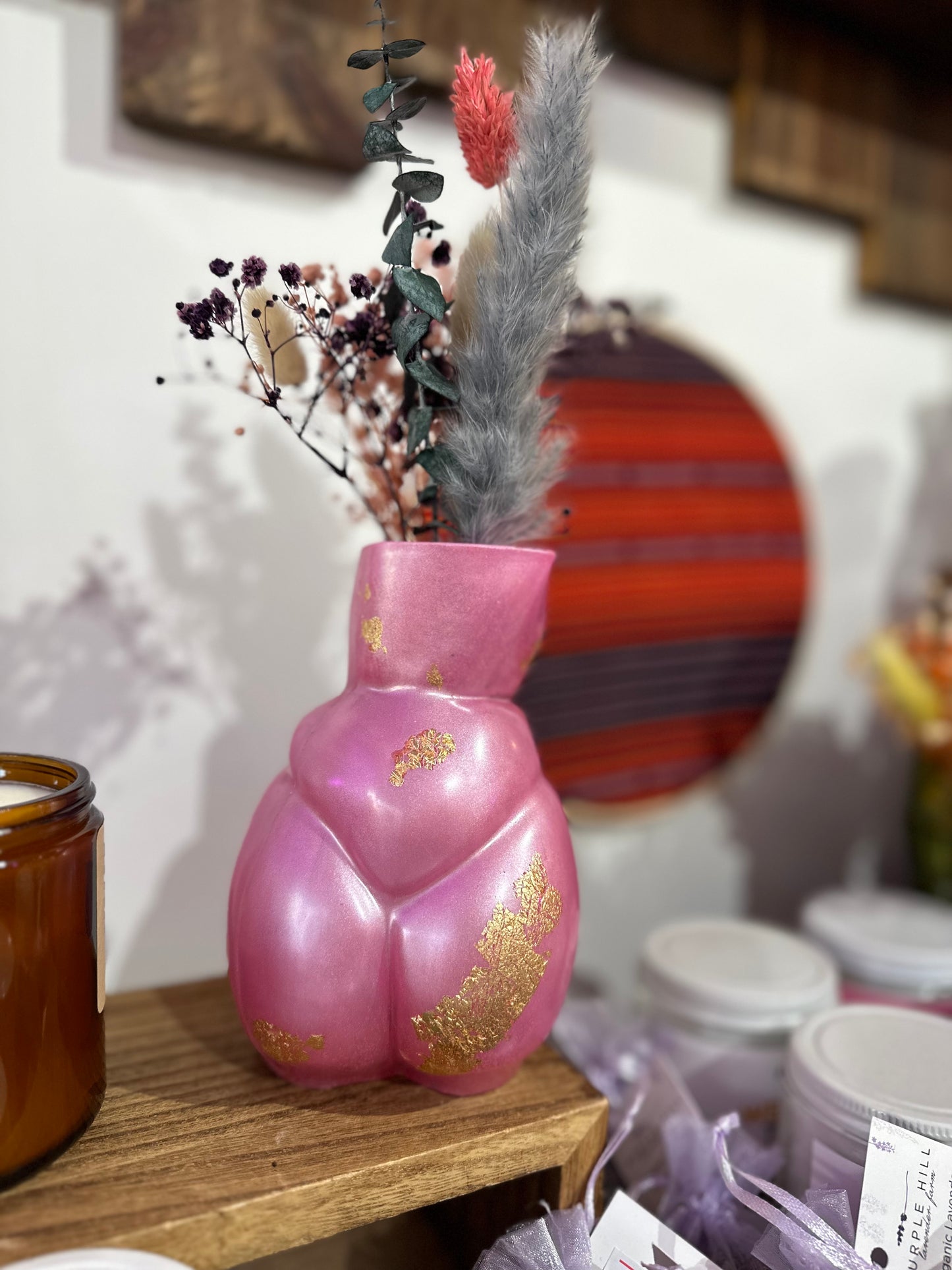 Resin vases with dried flower arrangements