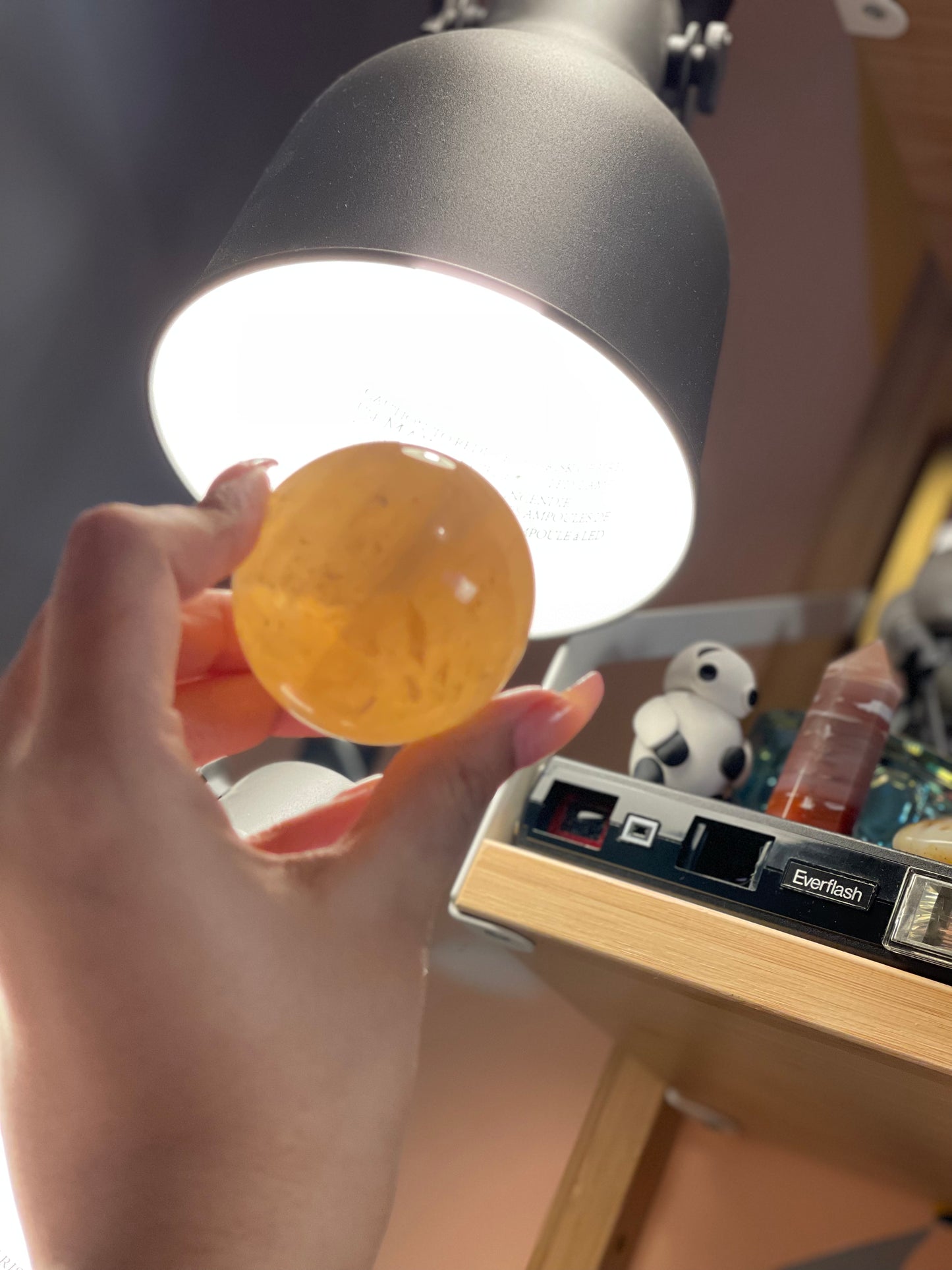 Honey calcite sphere with flash