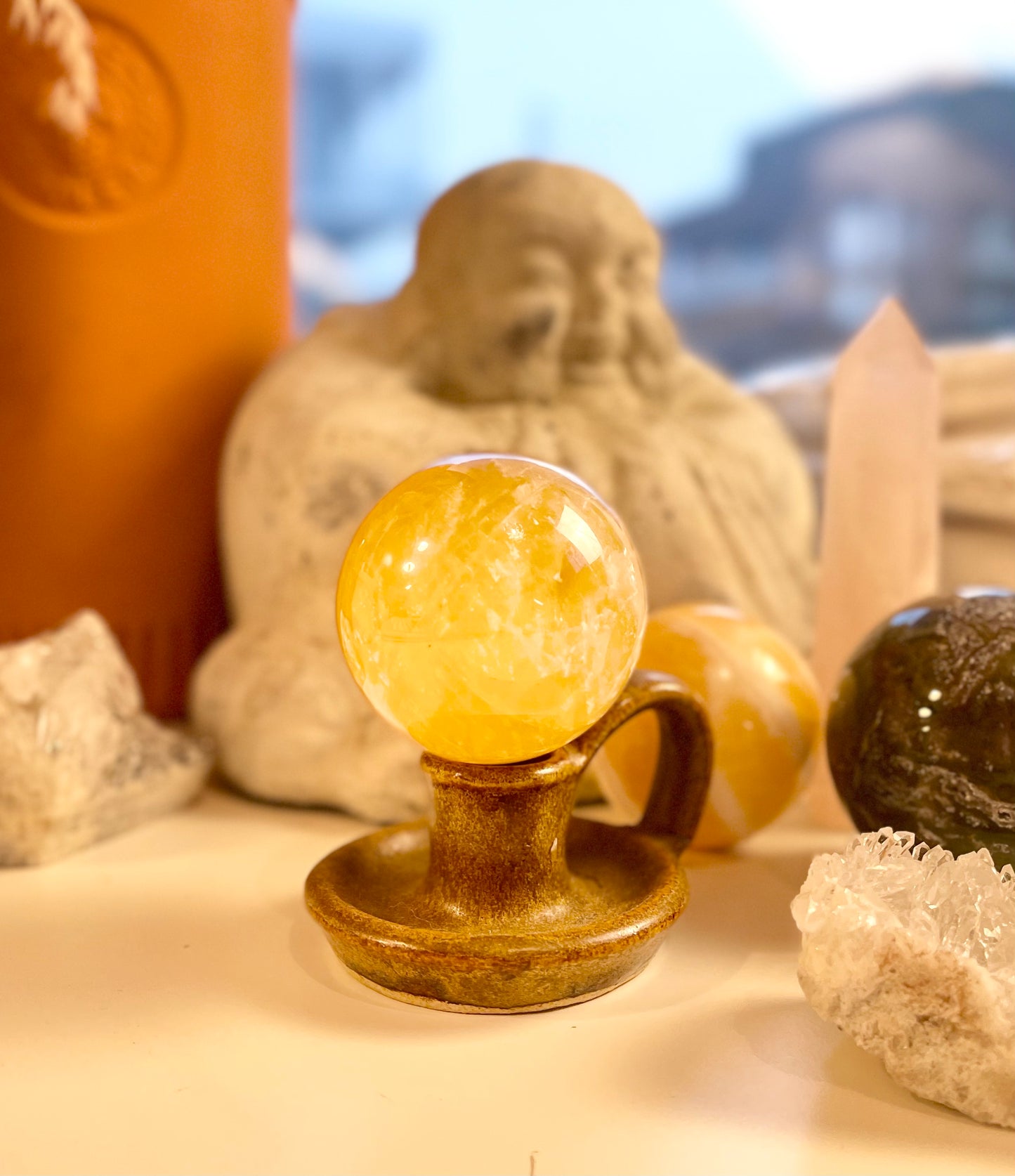 Honey calcite sphere with flash